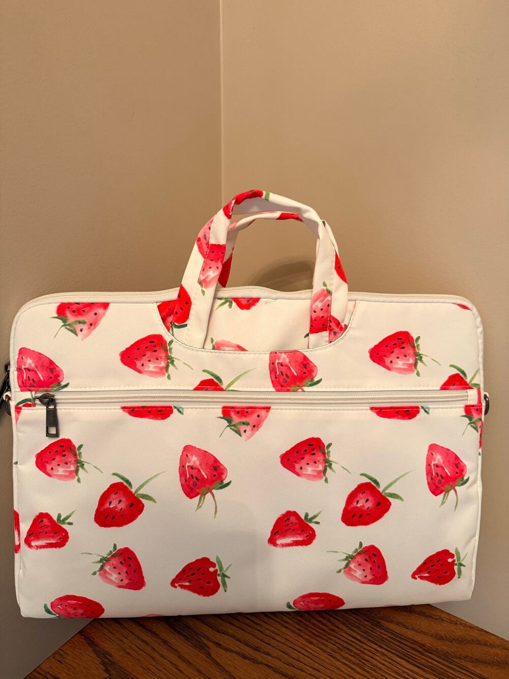 Canvaslove laptop sleeve features strawberry print, detachable shoulder strap